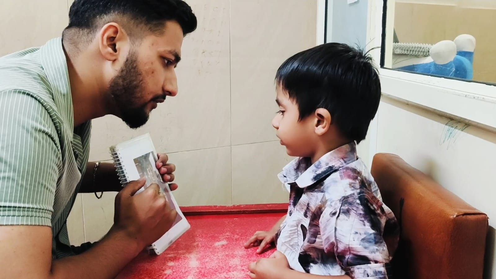 Happy child in speech therapy session